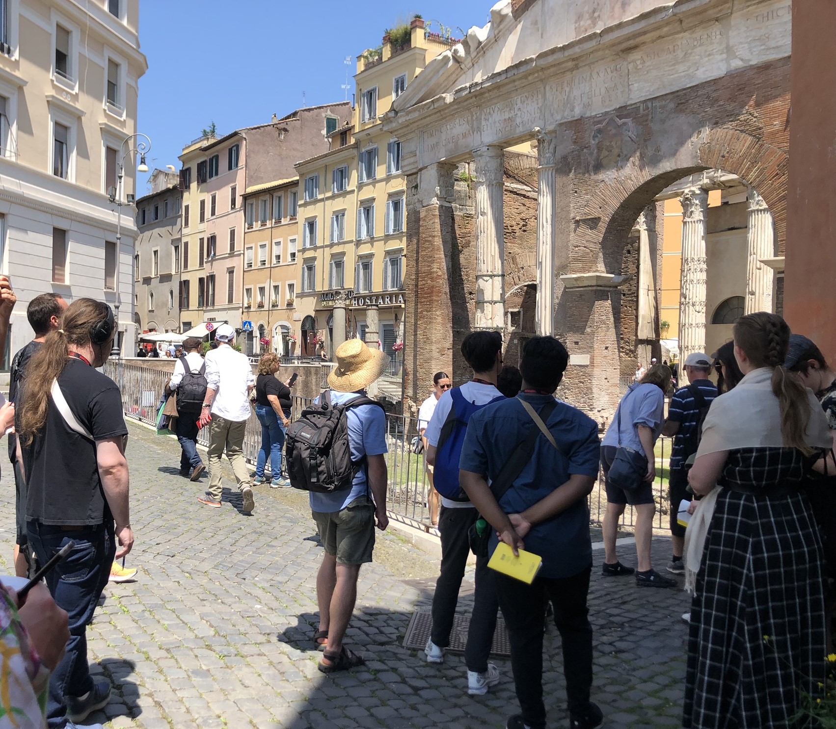 students look at an ancient monument