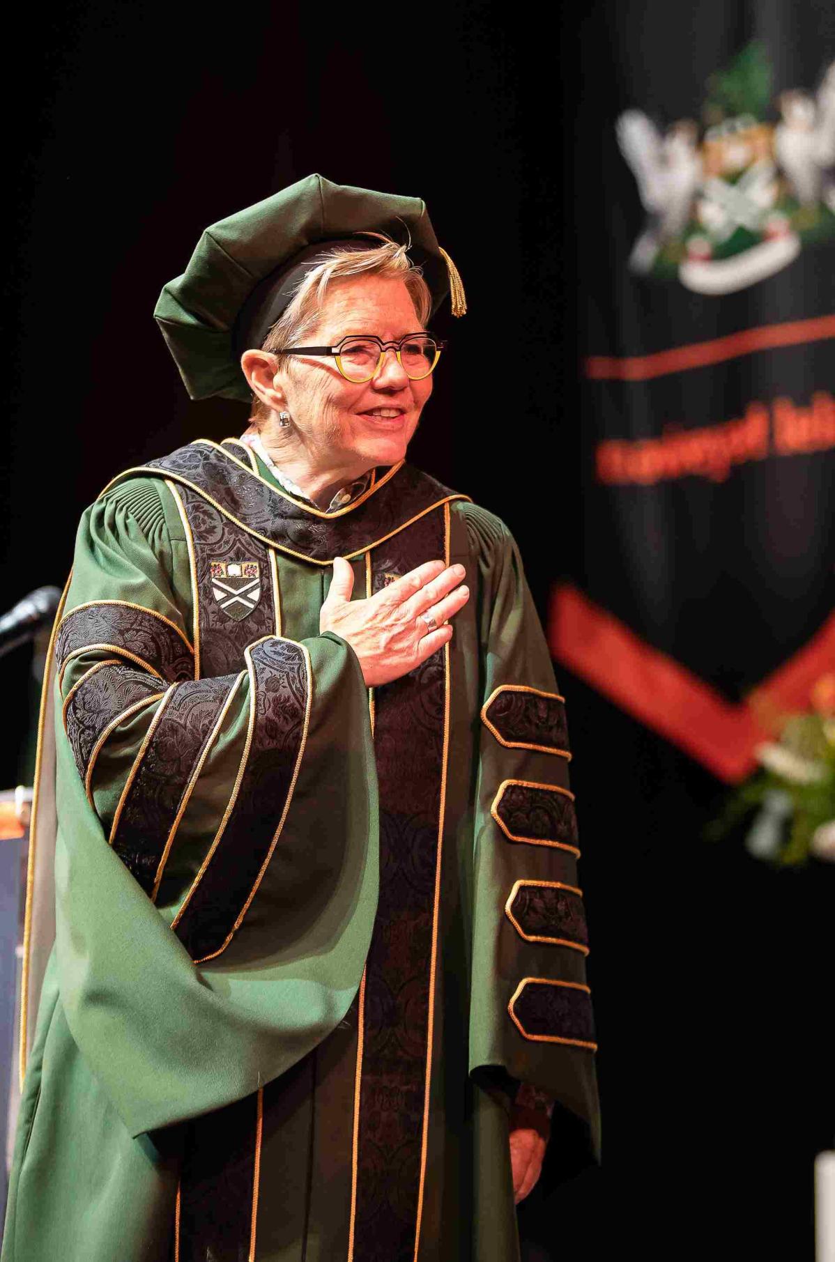 Dr. Paula Burns wears the president's regalia during convocation ceremonies