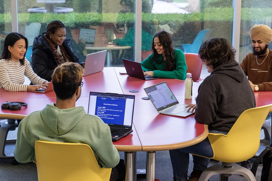 Students at a table in the library